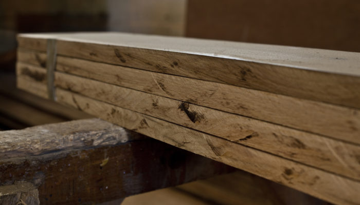 close up of reclaimed antique oak floor boards being prepared in our workshop