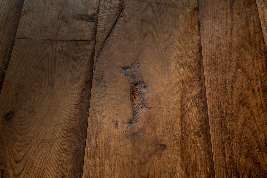 Close up detail of pit sawn reclaimed antique oak flooring showing natural character, art gallery Oxford