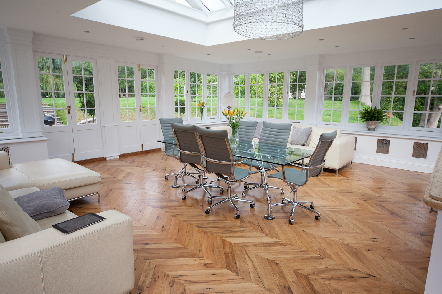 chevron parquet reclaimed pine solid wood flooring laid in kitchen diner Hertfordshire